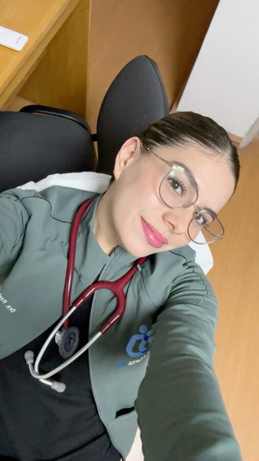 Clinician in scrubs with a stethoscope