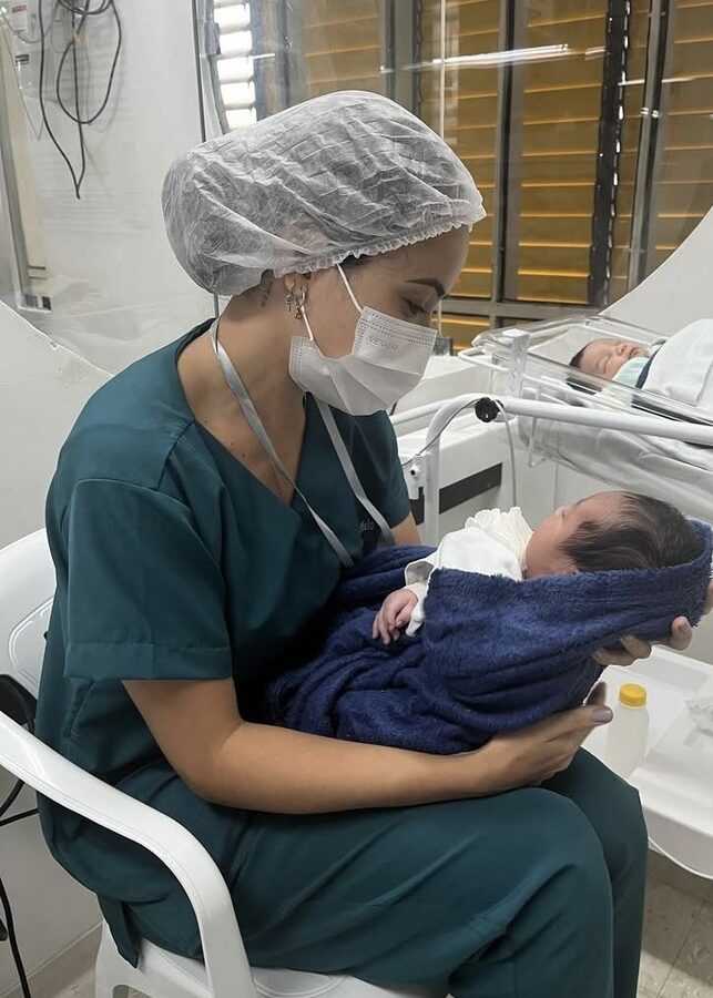 Clinician walking hand-in-hand with a child