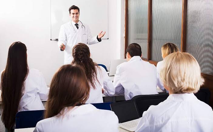 Instructor teaching a classroom of clinicians