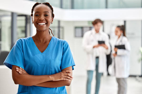 Nurse with colleagues in a hospital hallway