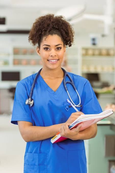 Portrait of a nurse holding a notebook
